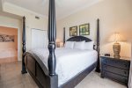 Master bedroom with private bathroom and king bed